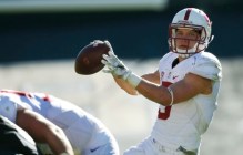 Stanford running back Christian McCaffrey, back, fades back to throw a pass for a touchdown against Colorado in the second half of an NCAA college football game Saturday, Nov. 7, 2015, in Boulder, Colo. Stanford won 42-10. (AP Photo/David Zalubowski)